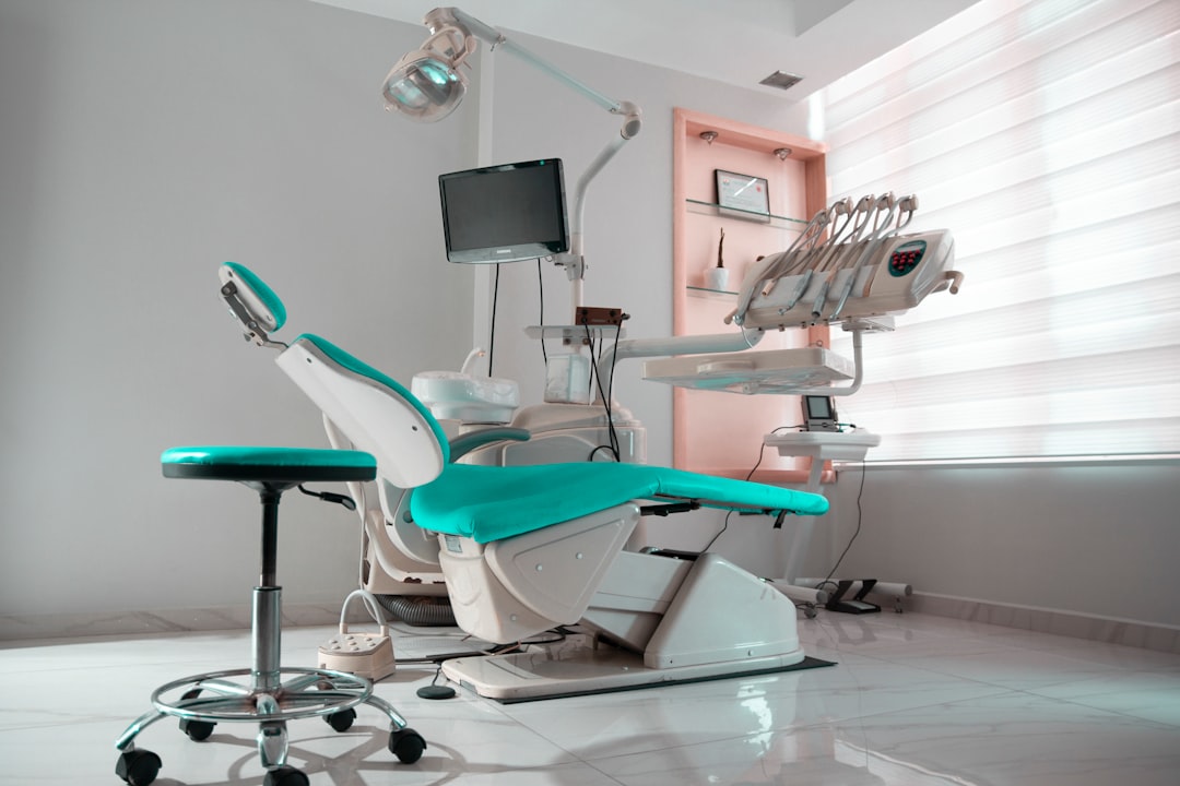 Modern dental treatment room with chair and equipment