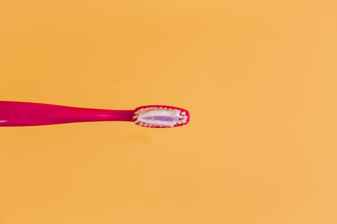 A toothbrush against a vibrant background